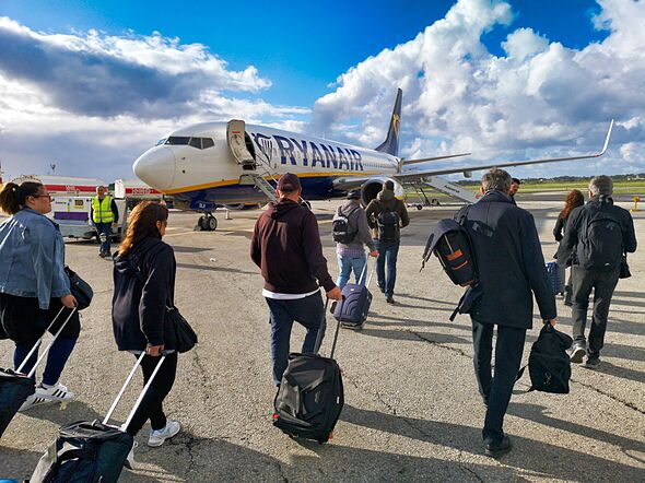 Ryanair passengers boarding a B737 airplane at Malta International Airport, Luqa