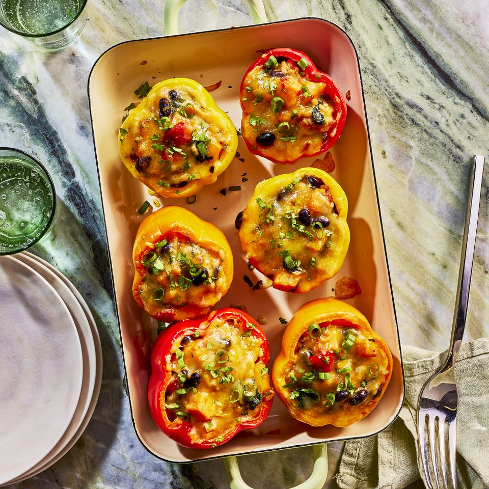 Image of Sweet Potato & Black Bean Stuffed Peppers in a baking dish Credit: Heami Lee, Food Stylist: Emily Nabors Hall, Prop Stylist: Christine Keeley