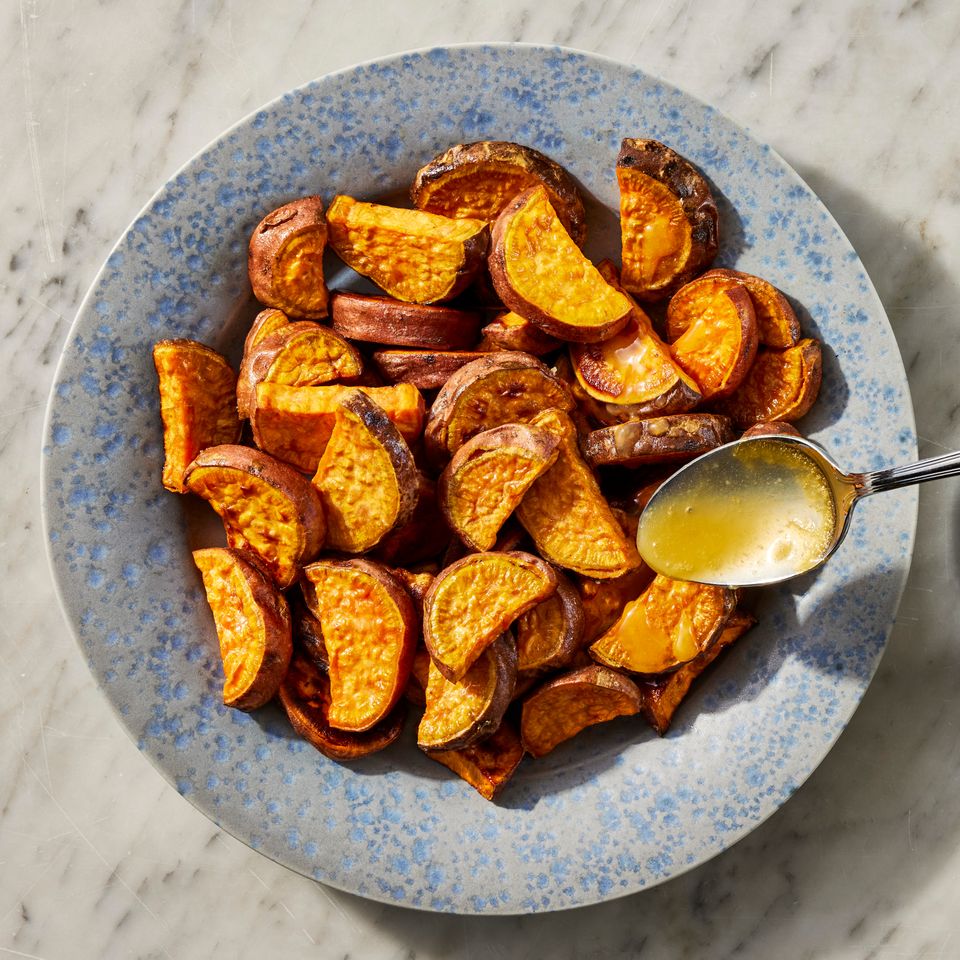an image of the glaze being poured over the potatoes Credit: Photographer: Jen Causey, Food Stylist: Emily Nabors Hall, Prop Stylist: Lindsey Lower