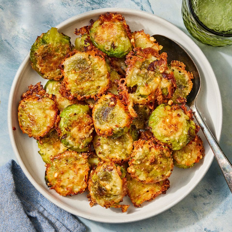 an image of the Crispy Garlic-Parmesan Smashed Brussels Sprouts Credit: Photographer: Robby Lozano, Food Stylist: Marianne Williams, Prop Stylist: Josh Hoggle