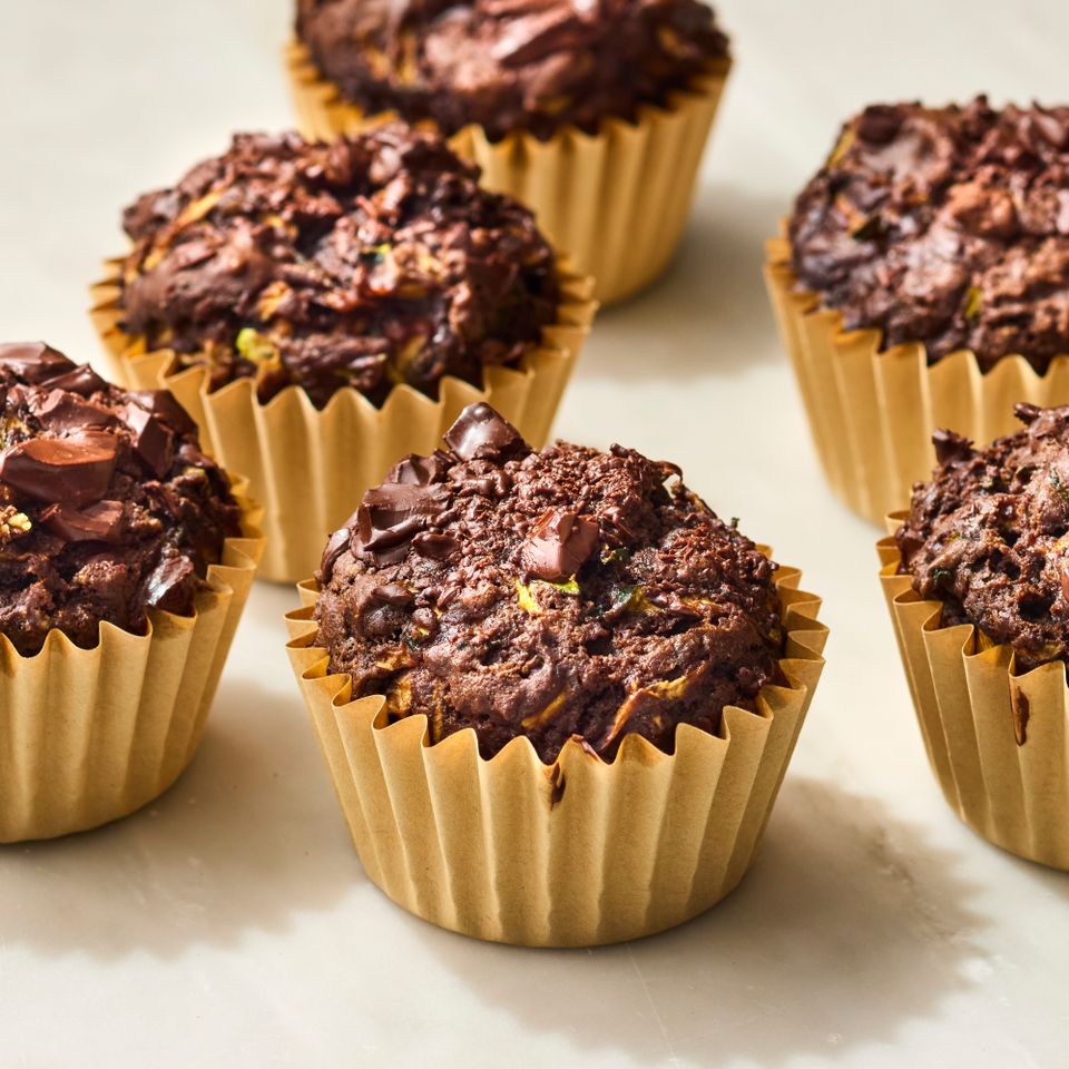 A recipe photo of Chocolate Zucchini Muffins. Credit: Photographer: Victor Protasio, Food Stylist: Chelsea Zimmer, Prop Stylist: Hannah Grennwood.