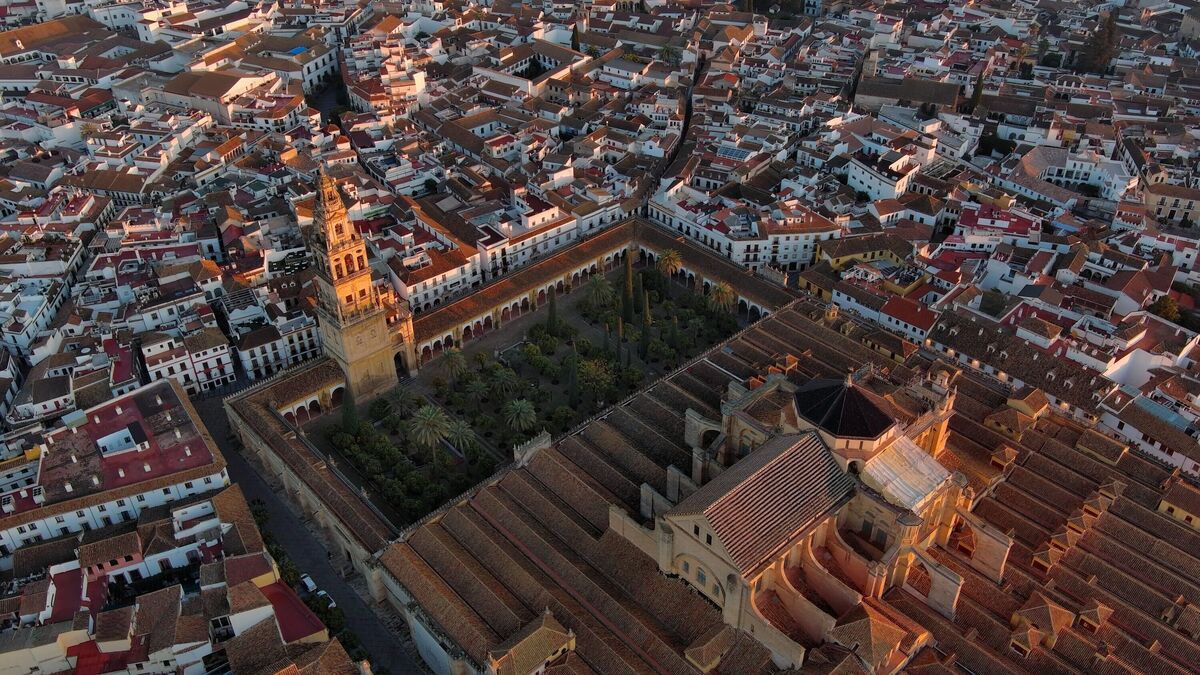 Aerial view of the Mosque–Cathedral of Cordoba and roman bridge over Guadalquivir river, UNESCO World Heritage Site, Andalusia, Spain