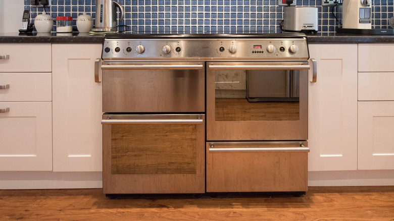 An oven in the middle of a kitchen counter.