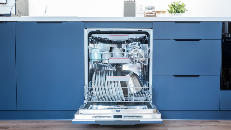Clean dishwasher in modern kitchen.