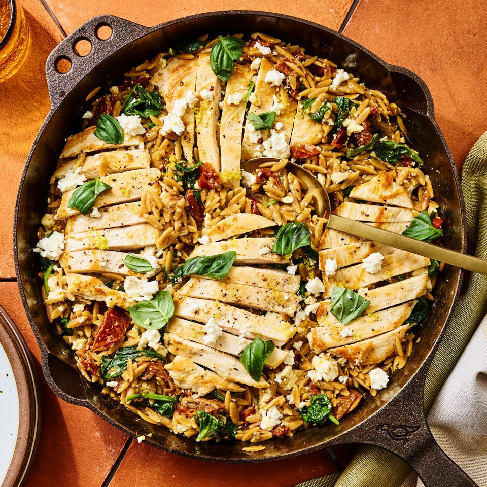 A recipe image of One-Pot Chicken, Spinach & Sun-Dried Tomato Orzo Credit: Photographer: Morgan Hunt Ward, Prop Stylist: Abby Armstrong, Food Stylist: Ruth Skipworth.