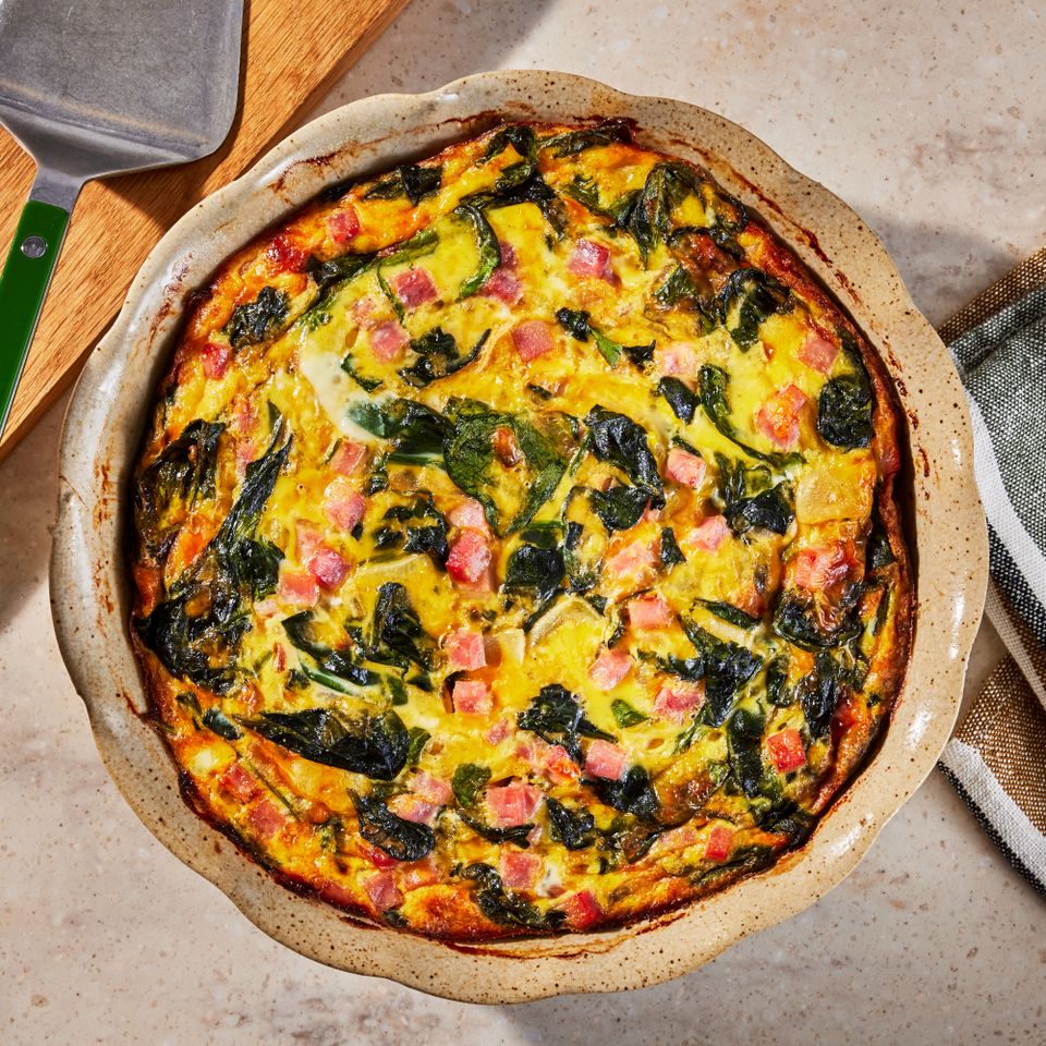 a recipe photo of the Ham & Spinach Quiche Credit: Photographer: Jen Causey, Food Stylist: Emily Nabors Hall, Prop Stylist: Phoebe Hauser