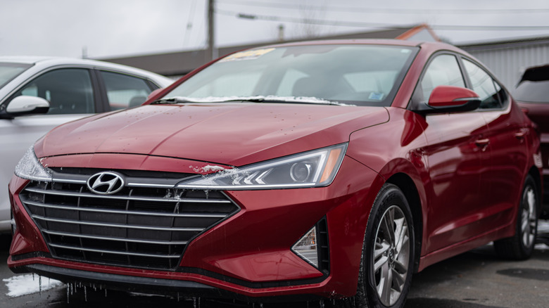 A 2020 Hyundai Sonata at a dealership with small amounts of ice and snow on it