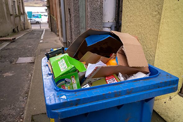 Oban-United Kingdom, February 07, 2026: Full garbage bin on a side street in the town of Oban in the Argyll and Bute district of Oban-United Kingdom, February 07, 2026: Full garbage bin on a side street in the town of Oban in the Argyll and Bute district of