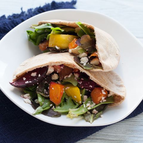 Plate with pita bread stuffed with assorted vegetables Credit: EatingWell