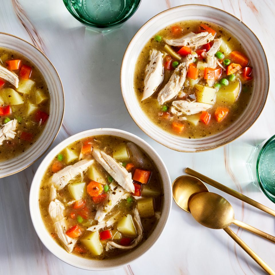 a recipe photo of the Chicken Soup with Recaito & Potatoes served in 3 bowls