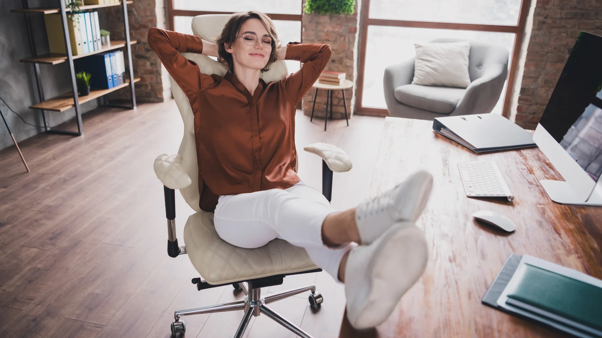 woman who needs naps and quiet time to function finding a moment to decompress in the office