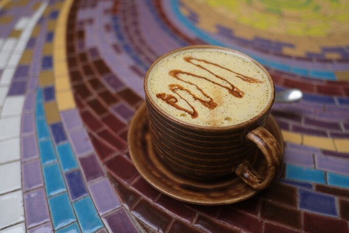 Egg coffee features thick yellow foam. Photo by Read/Quynh Mai