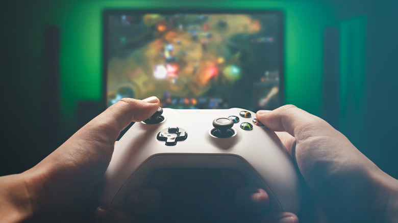 Man playing video game on TV
