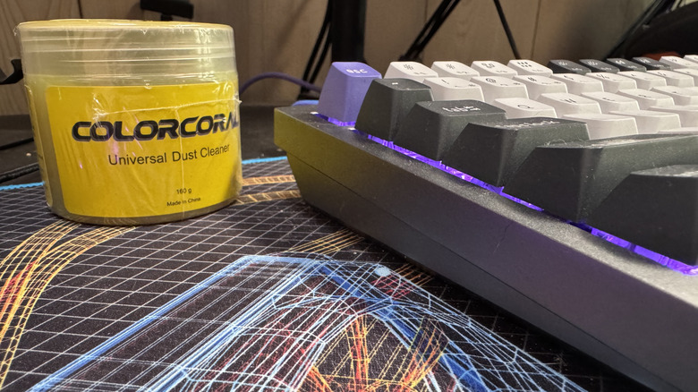 A close up shot of cleaning gel next to a keyboard