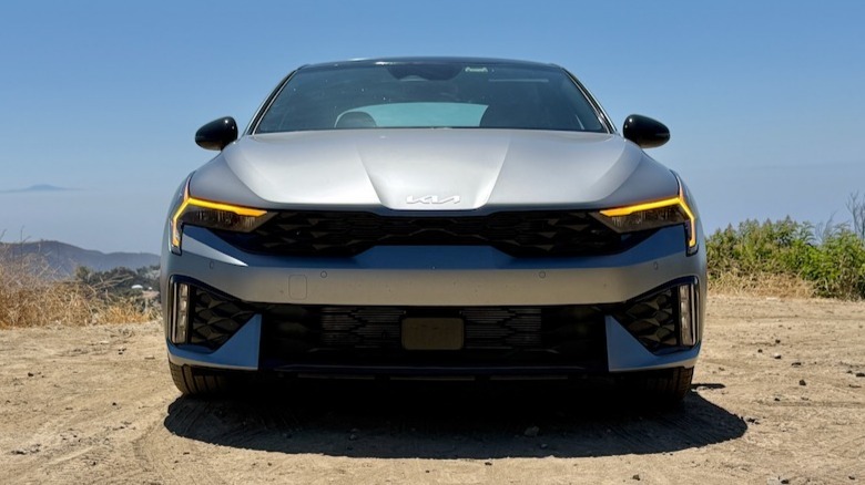 2026 Kia K5 GT-Line front view parked on a mountainside