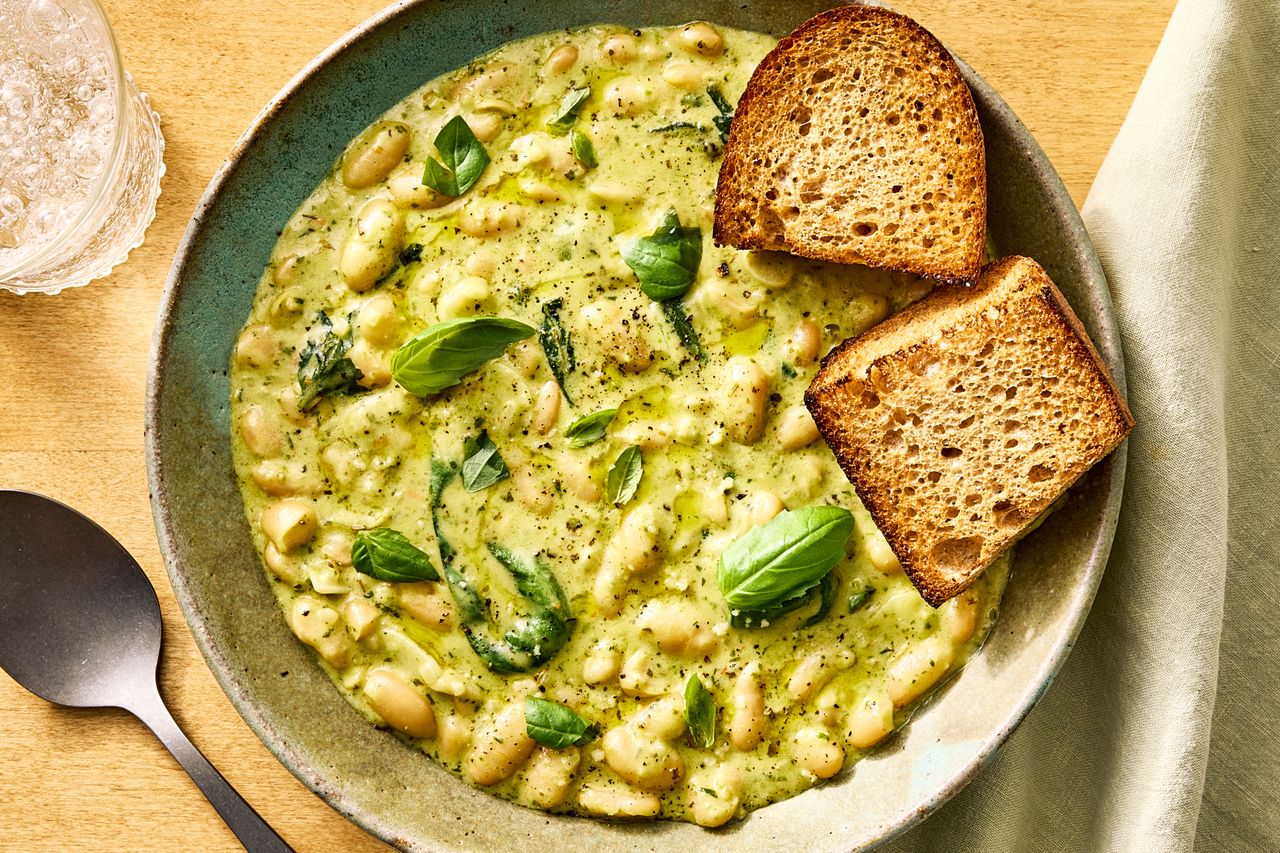 an image of the White Beans with Creamy Pesto Sauce Credit: Photographer: Morgan Hunt Glaze, Food Stylist: Julian Hensarling, Prop Stylist: Abby Armstrong