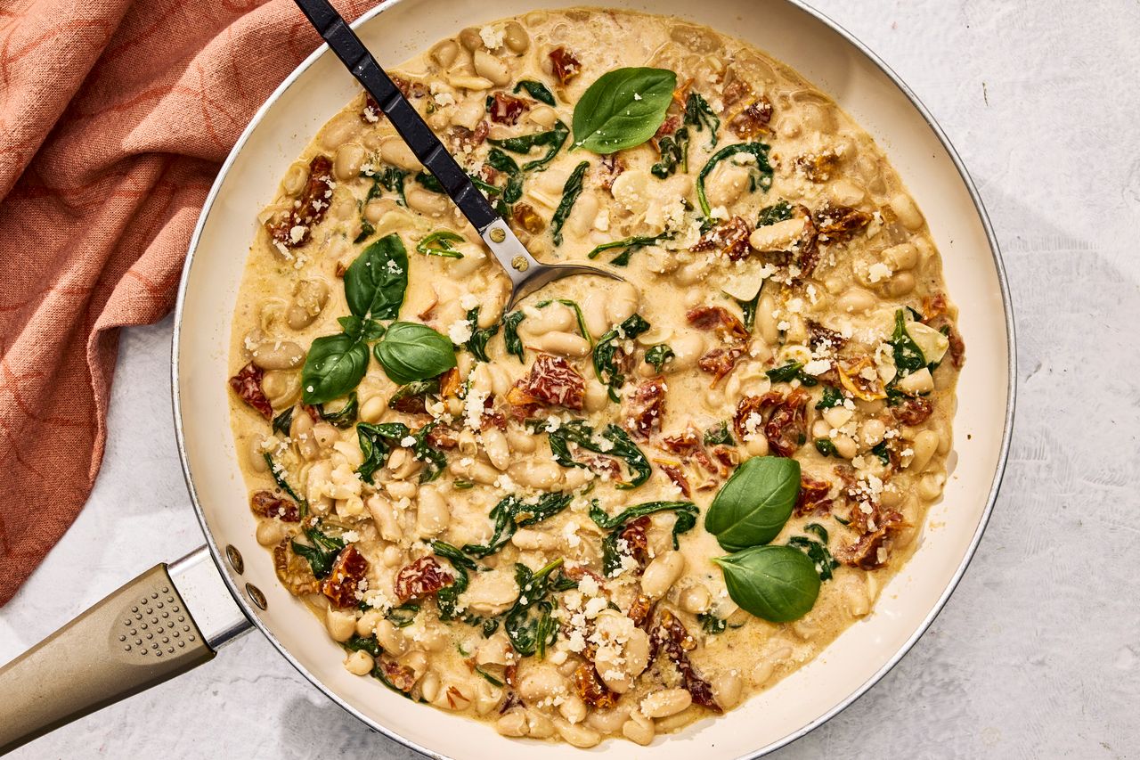 an image of the Marry Me White Bean & Spinach Skillet Credit: Photographer: Morgan Hunt Glaze, Prop Stylist: Abby Armstrong, Food Stylist: Margaret Monroe Dickey