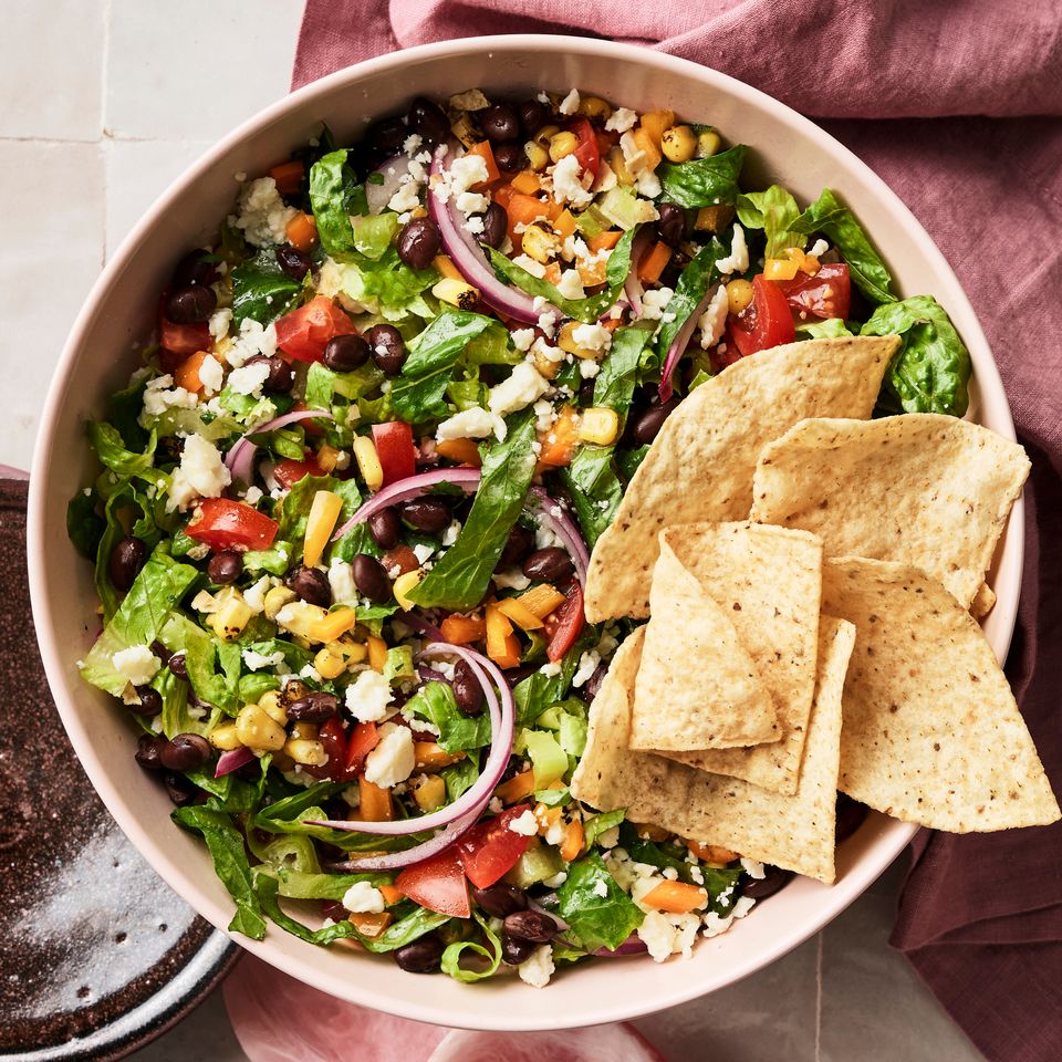 A recipe image of Loaded Chopped Taco Salad Bowl Credit: Photographer: Greg Dupree, Prop Stylist: Julia Bayless, Food Stylist: Chelsea Zimmer.