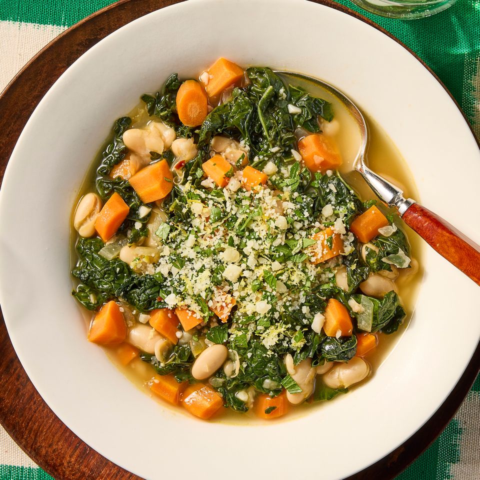 A recipe image of Garlicky White Bean & Kale Stew with Lemon. Credit: Photographer: Jen Causey, Food Stylist: Jennifer Wendorf, Prop Stylist: Phoebe Hausser.