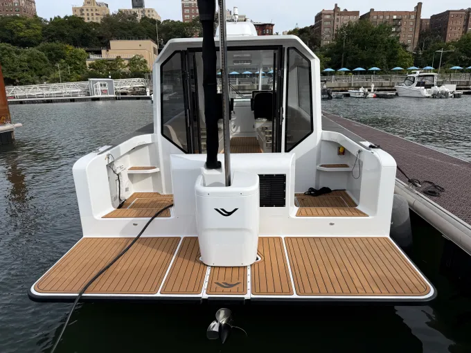 A hydrofoil ferry docked with its rear foil raised.