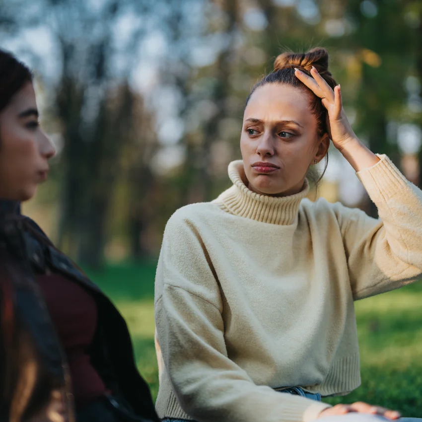 Stressed woman saying "it sounds like you need to reflect" to her friend.