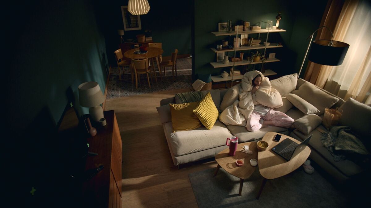 woman sitting on sofa at home