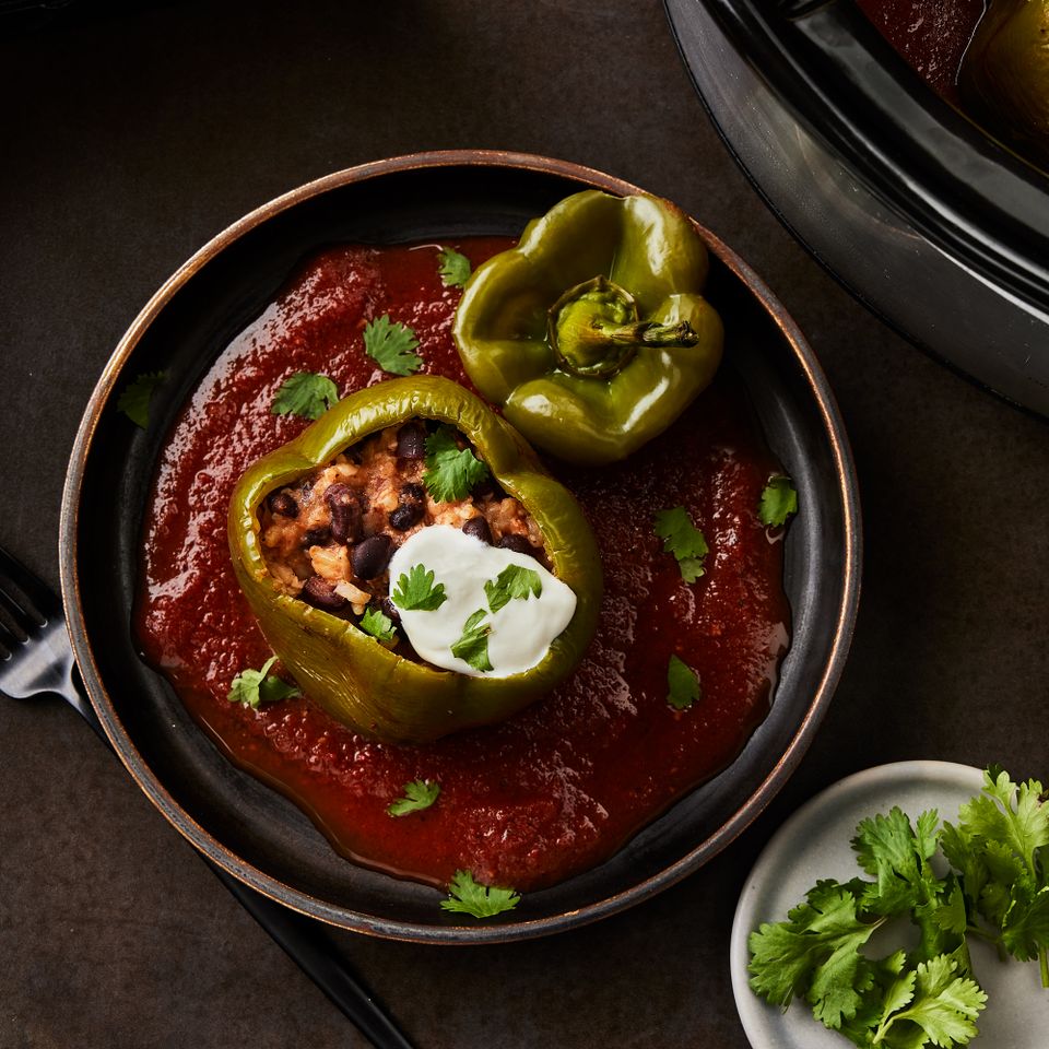 a recipe photo of the Slow-Cooker Black Bean & Brown Rice Stuffed Peppers Credit: Photographer: Greg DuPree, Food Stylist: Ali Ramee Prop Stylist: Christine Keely