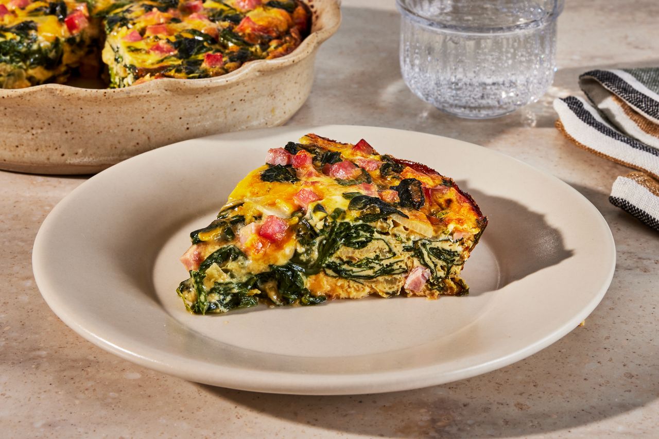 a recipe photo of the Ham & Spinach Quiche Credit: Photographer: Jen Causey, Food Stylist: Emily Nabors Hall, Prop Stylist: Phoebe Hauser