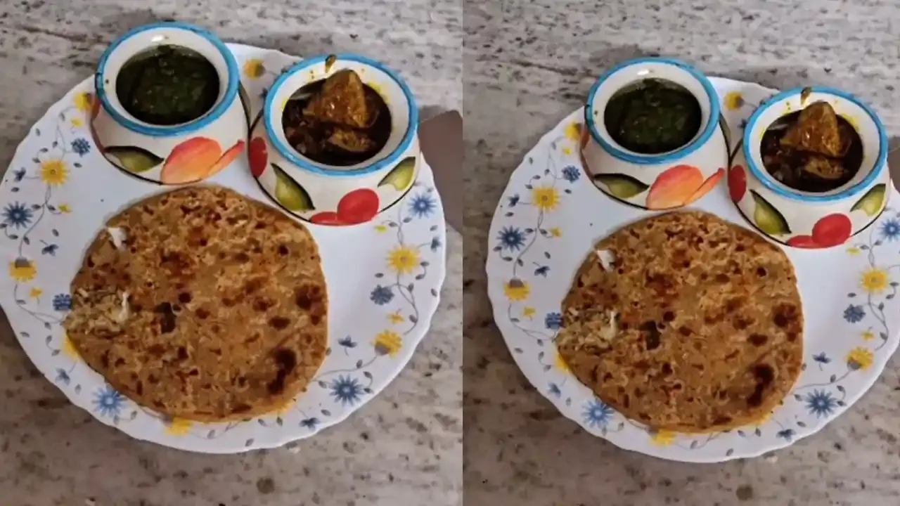 Seasoned cooked rice mixed with spices and stuffed inside wheat dough before being rolled and cooked on a hot tawa.