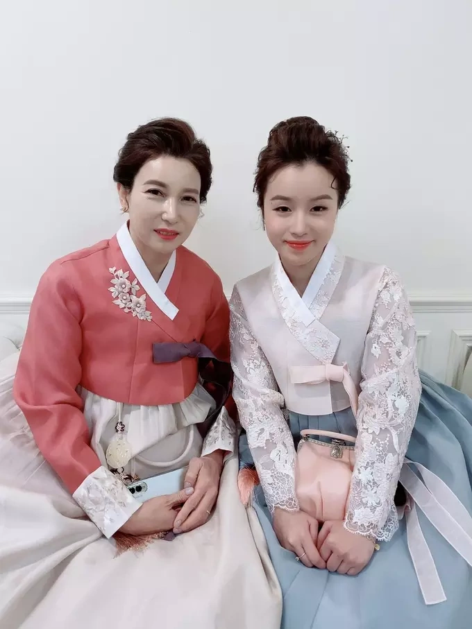 Tho and her Korean mother-in-law pose for a photo in traditional Korean attire. Photo courtesy of Tho