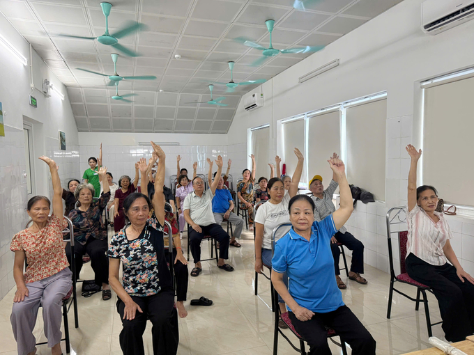 Elderly people exercise at Bo De ward day care facility. Photo: Mai Phuong