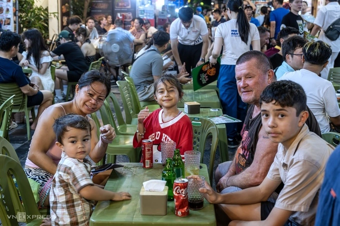 Irene’s family enjoys a meal in Hanoi. Photo by Read/Giang Huy