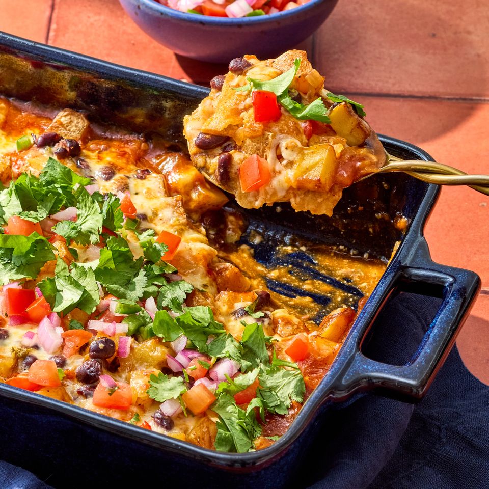A recipe image of Black Bean-Potato Enchilada Casserole Credit: Photographer: Grant Webster, Food Stylist: Holly Dreesman, Prop Stylist: Dera Burreson.