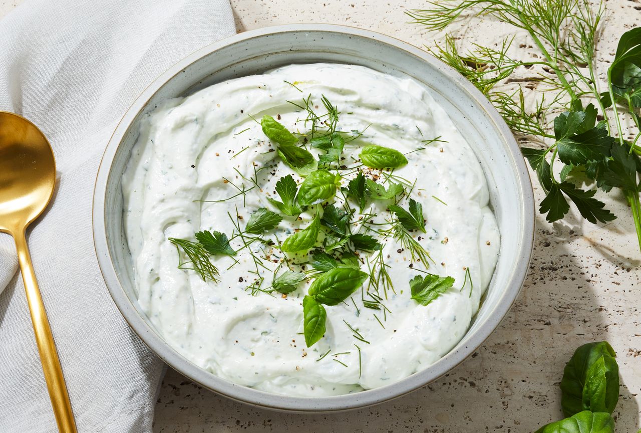 Light & airy whipped cottage cheese in a ceramic bowl, topped wiht fresh herbs Credit: Photography: Rachel Marek, Food Stylist: Annie Probst