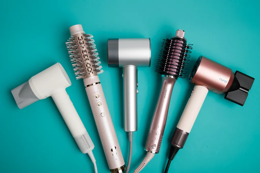 An image of different hair dryers on a blue background
