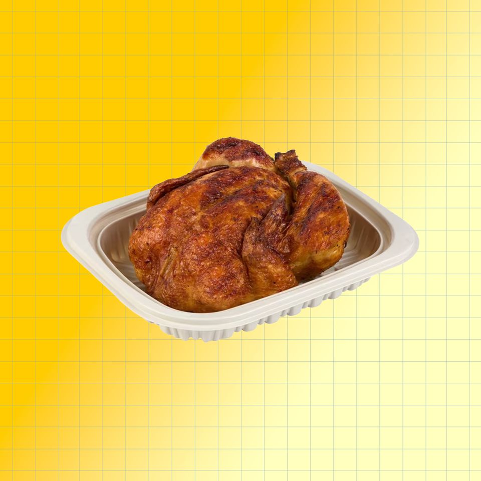 A rotisserie chicken in a disposable container on a yellow grid background Credit: Costco. EatingWell design.